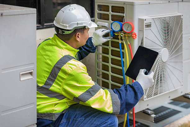 Professional Hvac technician working in Amazonia, MO